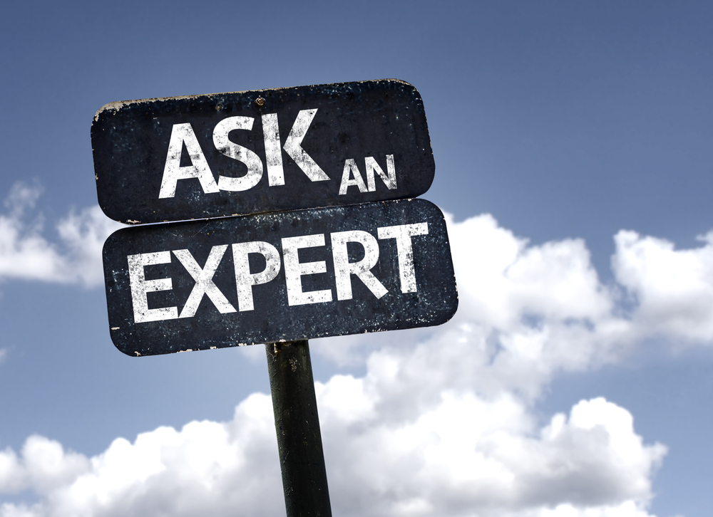 Ask An Expert sign with clouds and sky background